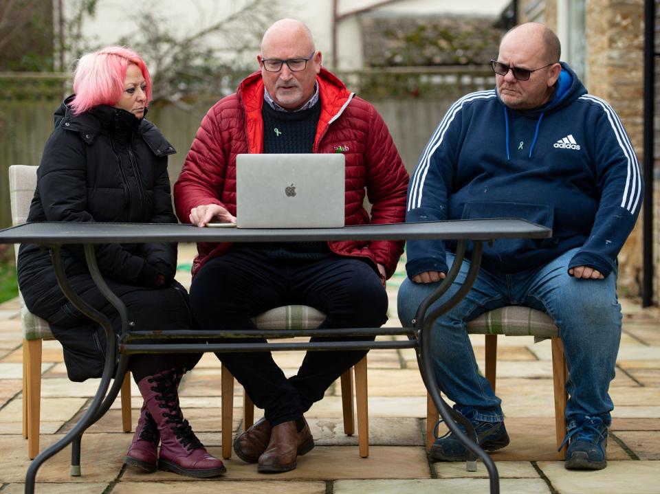 Charlotte Charles and Tim Dunn with family adviser Radd Seiger (centre) at home in Oxfordshire after hearing they had lost their High Court battleJacob King/PA