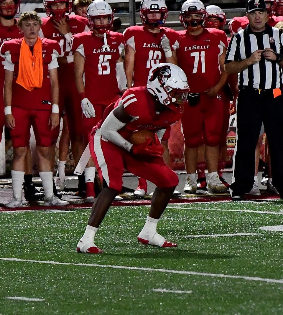 Jaylen Grant secures a completed pass for La Salle at the La Salle vs. Louisville-Trinity football game Friday, Sept. 9, 2022.