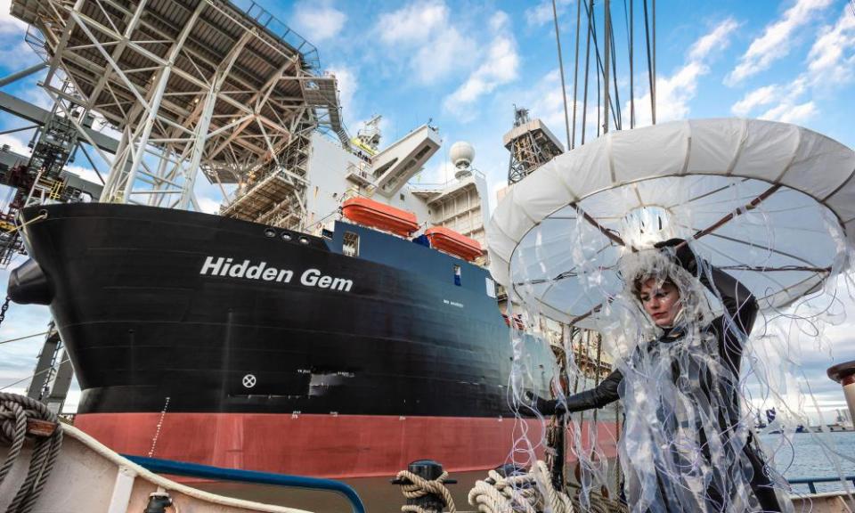 An Ocean Rebellion protest in Rotterdam against the exploitation of the seabed, with the deep-sea mining vessel Hidden Gem in the background.