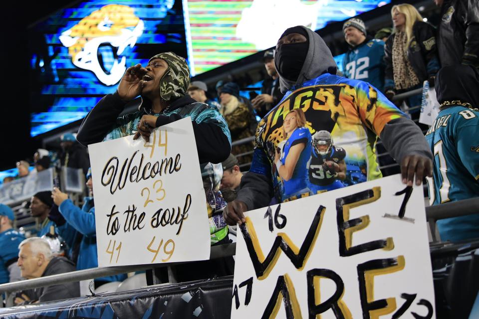 Jaguars fans celebrate the team before last week's playoff game against the Los Angeles Chargers, at TIAA Bank Field.