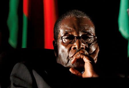 Zimbabwean President Robert Mugabe watches a video presentation during the summit of the Southern African Development Community (SADC) in Johannesburg, South Africa August 17, 2008. REUTERS/Mike Hutchings/Files