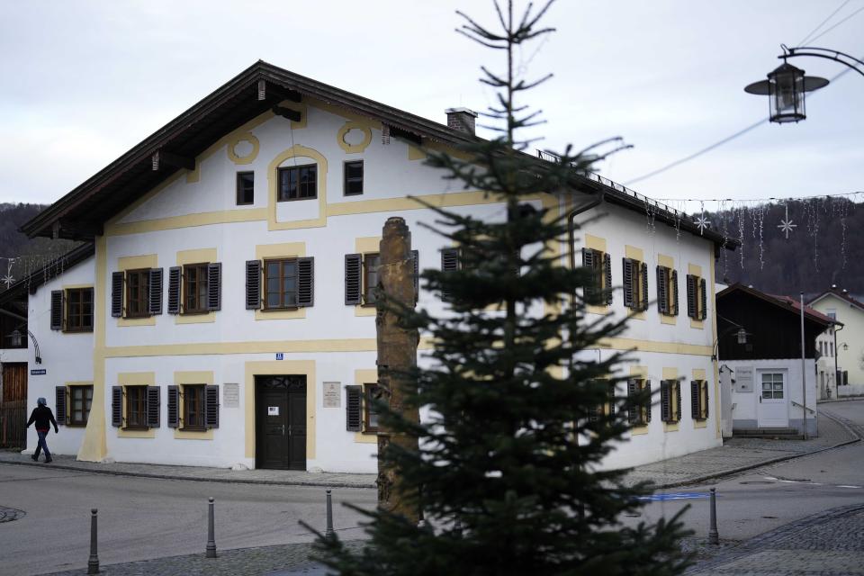 A person passes the birthplace of Pope emeritus Benedict XVI in Marktl, Germany, Thursday, Dec. 29, 2022. The health of Pope Emeritus Benedict XVI has worsened due to his age, and doctors are constantly monitoring the 95-year-old's condition, the Vatican said Wednesday.(AP Photo/Matthias Schrader)