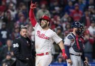Mar 31, 2019; Philadelphia, PA, USA; Philadelphia Phillies right fielder Bryce Harper (3) reacts as he crosses home plate in front of Atlanta Braves catcher Brian McCann (16) after hitting a home run during the seventh inning at Citizens Bank Park. Mandatory Credit: Bill Streicher-USA TODAY Sports