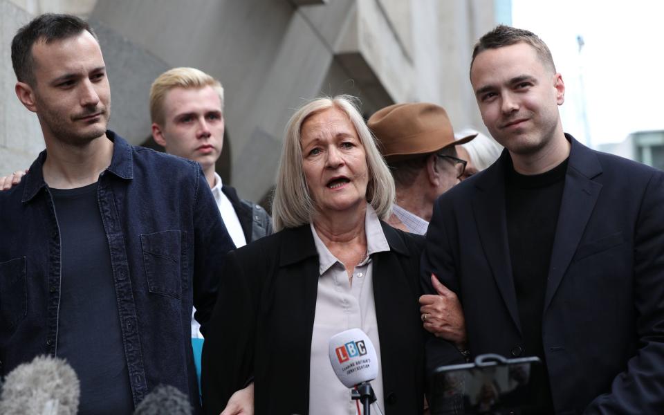 Sally Challen, flanked by her two sons, leaving the Old Bailey in 2019 after hearing she will finally walk free