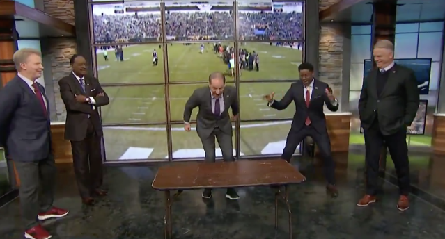 Bill Cowher joined the Bills Mafia by jumping through a table