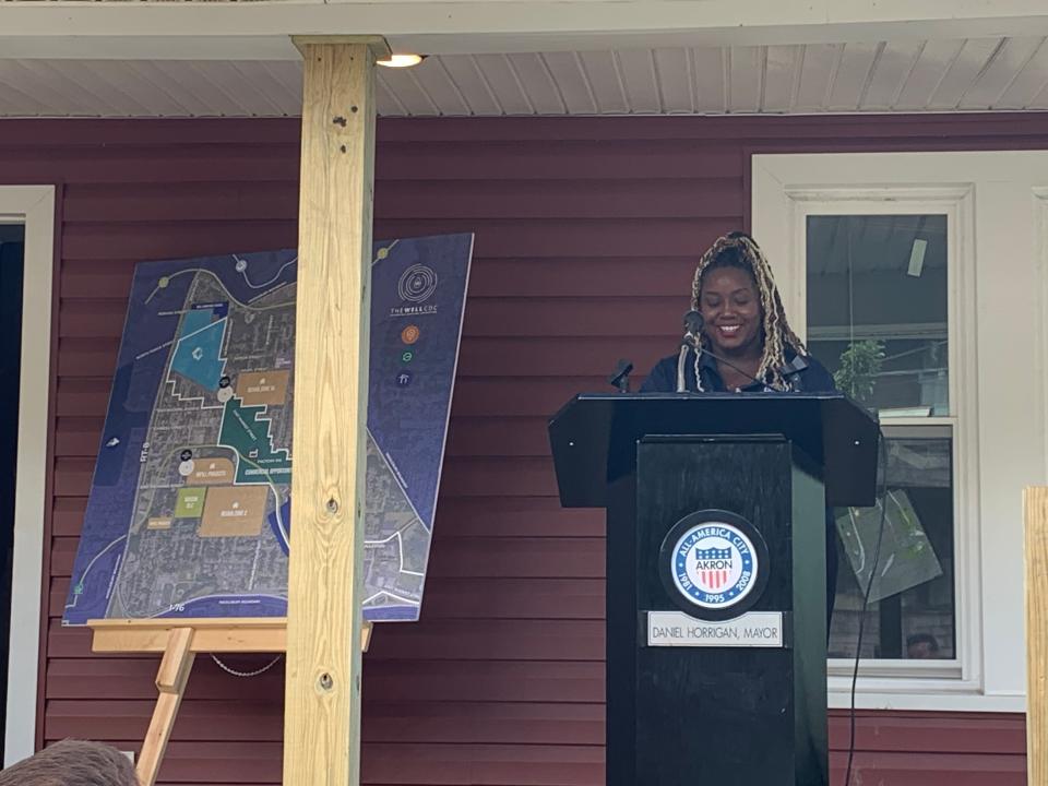 Makita Gulley speaks at the Thursday morning press conference. She is a tenant living in a home renovated and owned by the Well CDC. She also works for the nonprofit as a business manager.