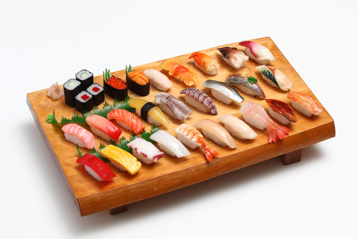 A display of nigiri and makizushi features everything from tamago (egg) nigiri to tuna maki. (Japan House LA)