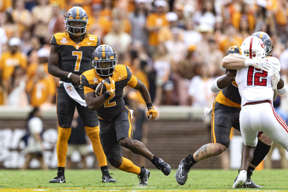 Tennessee running back Jabari Small (2) runs for yardage during the first half of an NCAA college football game against Austin Peay, Saturday, Sept. 9, 2023, in Knoxville, Tenn. (AP Photo/Wade Payne)