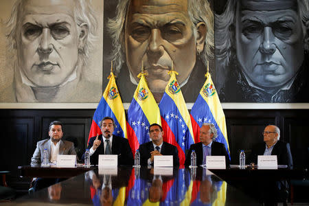 The lawyer Juan Manuel Rafalli (2nd L) speaks, next to the deputies of the Venezuelan coalition of opposition parties (MUD) Eudoro Gonzalez (L) and Juan Miguel Matheus (C), and the lawyers Roman Duque (R) and Eugenio Hernandez-Breton (2nd R), during a news conference in Caracas, Venezuela April 2, 2017. REUTERS/Carlos Garcia Rawlins