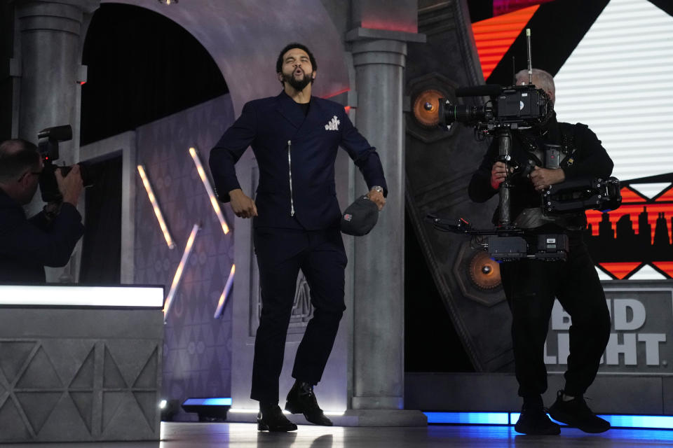 Southern California quarterback Caleb Williams celebrates after being chosen by the Chicago Bears with the first overall pick during the first round of the NFL football draft, Thursday, April 25, 2024, in Detroit. (AP Photo/Jeff Roberson)