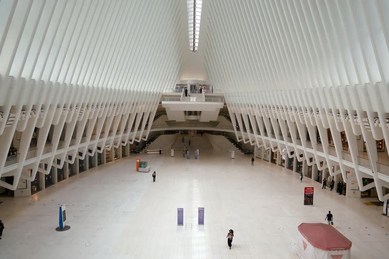 People walk though the Oculus transportation hub is pictured at the 9/11 Memorial site
