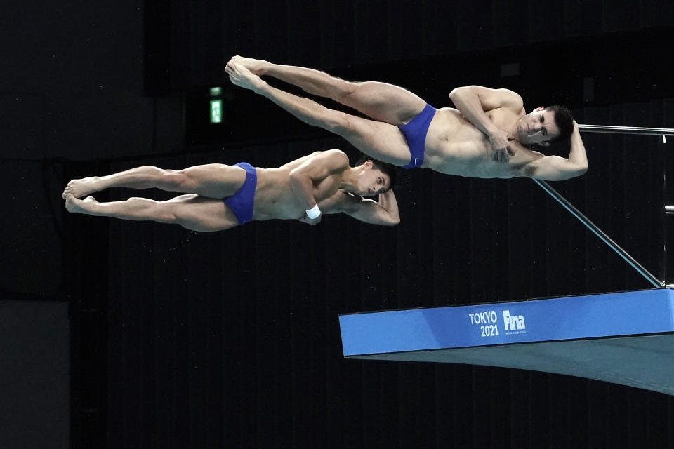 Ivan Garcia Navarro and Randal Willard Valdez of Mexico perform a dive, during the men's synchronized 10-meter platform finals of the FINA Diving World, Cup Saturday, May 1, 2021, at the Tokyo Aquatics Centre in Tokyo. Garcia Navarro and Willard Valdez won the silver medals in the category. (AP Photo/Eugene Hoshiko)