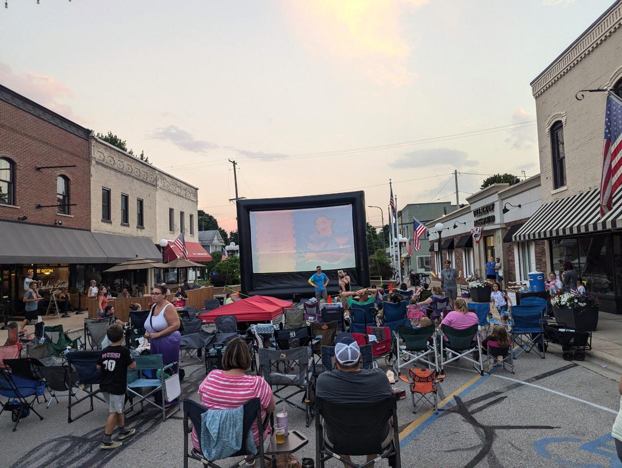 A crowd of people is pictured gathered in downtown Blissfield in June 2024 for the village's monthly Movies on Lane programming. "Lilo & Stitch" was the movie that was shown as part of the 2024 summer edition of Movies on Lane.