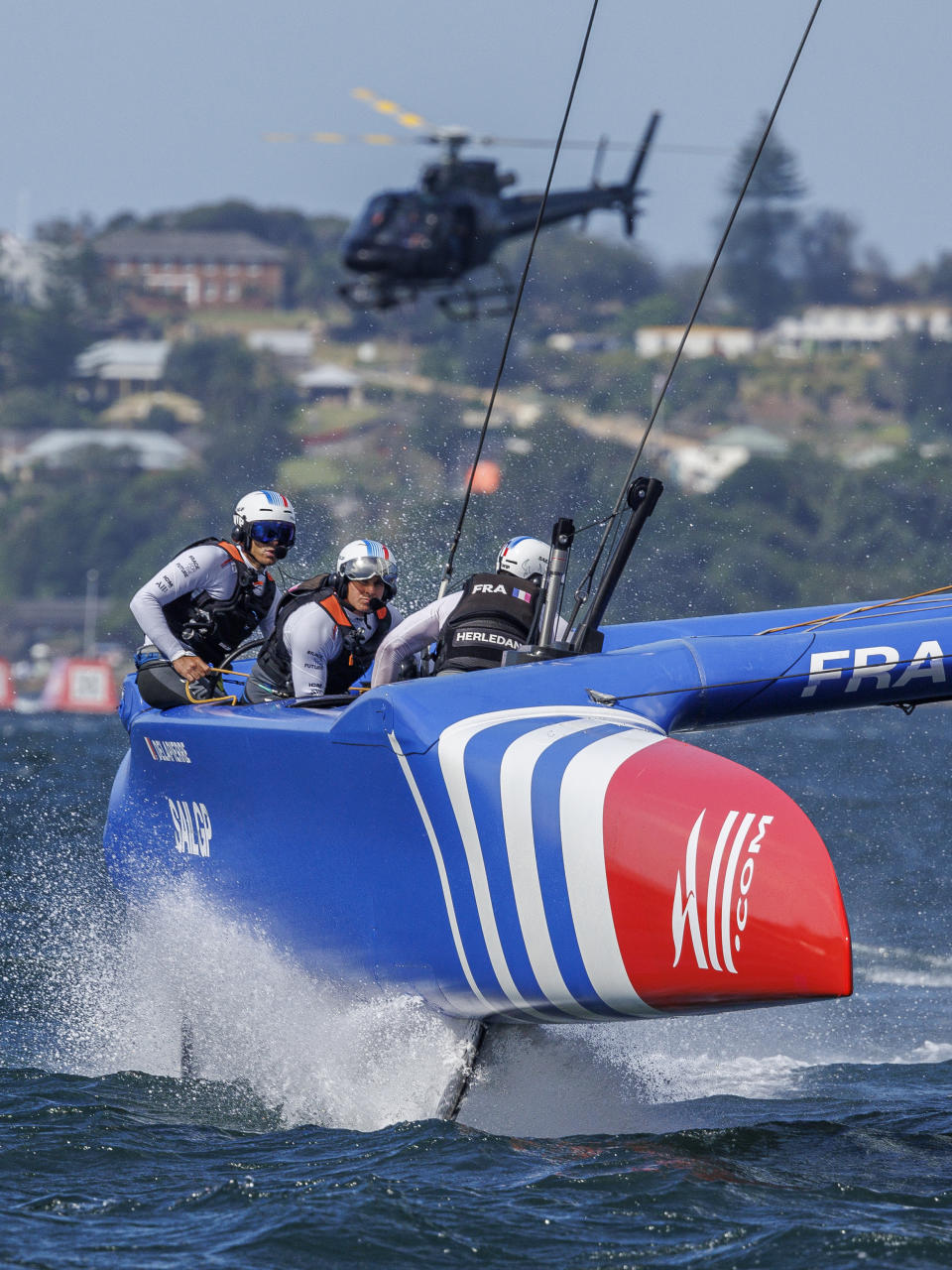 In this photo provided by SailGP, France SailGP team-members Quentin Delapierre, Francois Morvan, and Olivier Herledant, compete during race 1 of the Australia Sail Grand Prix in Sydney, Australia, Saturday Feb. 18, 2023. (David Gray/SailGP via AP)