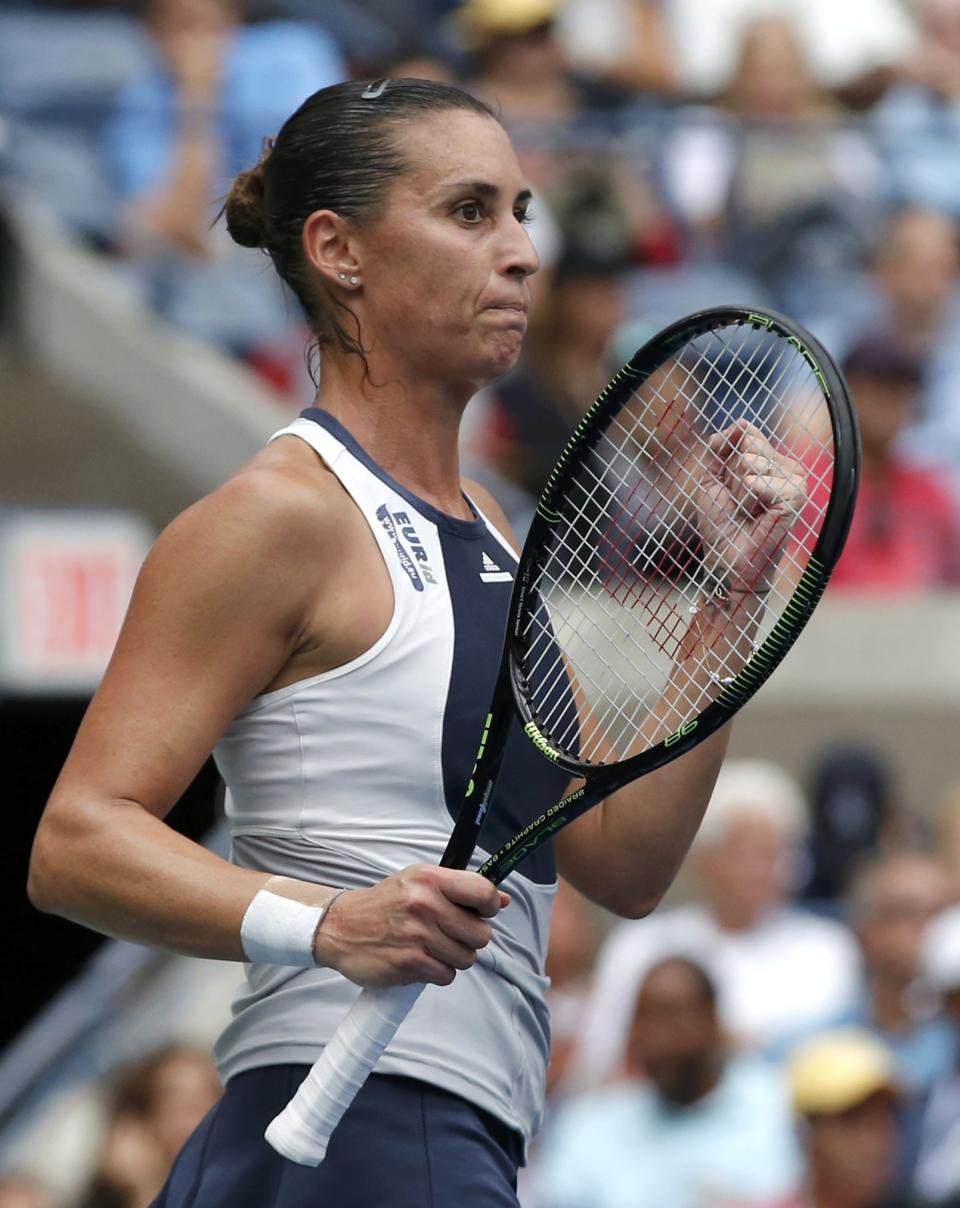 Flavia Pennetta of Italy celebrates winning a first set tie-break against compatriot Roberta Vinci during their women's singles final match at the U.S. Open Championships tennis tournament in New York, September 12, 2015. REUTERS/Mike Segar