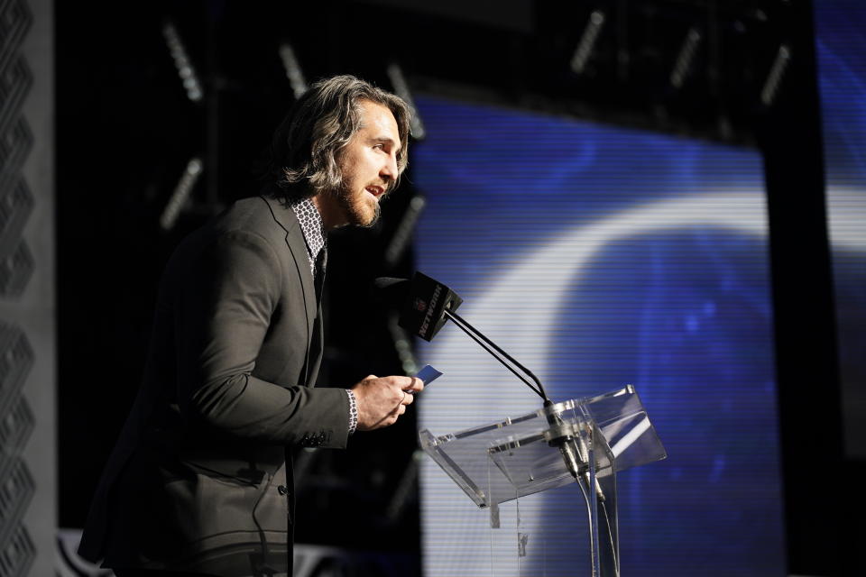 Anthony Castonzo announces Cincinnati wide receiver Alec Pierce as the Indianapolis Colts selection during the second round of the NFL football draft Friday, April 29, 2022, in Las Vegas. (AP Photo/John Locher)