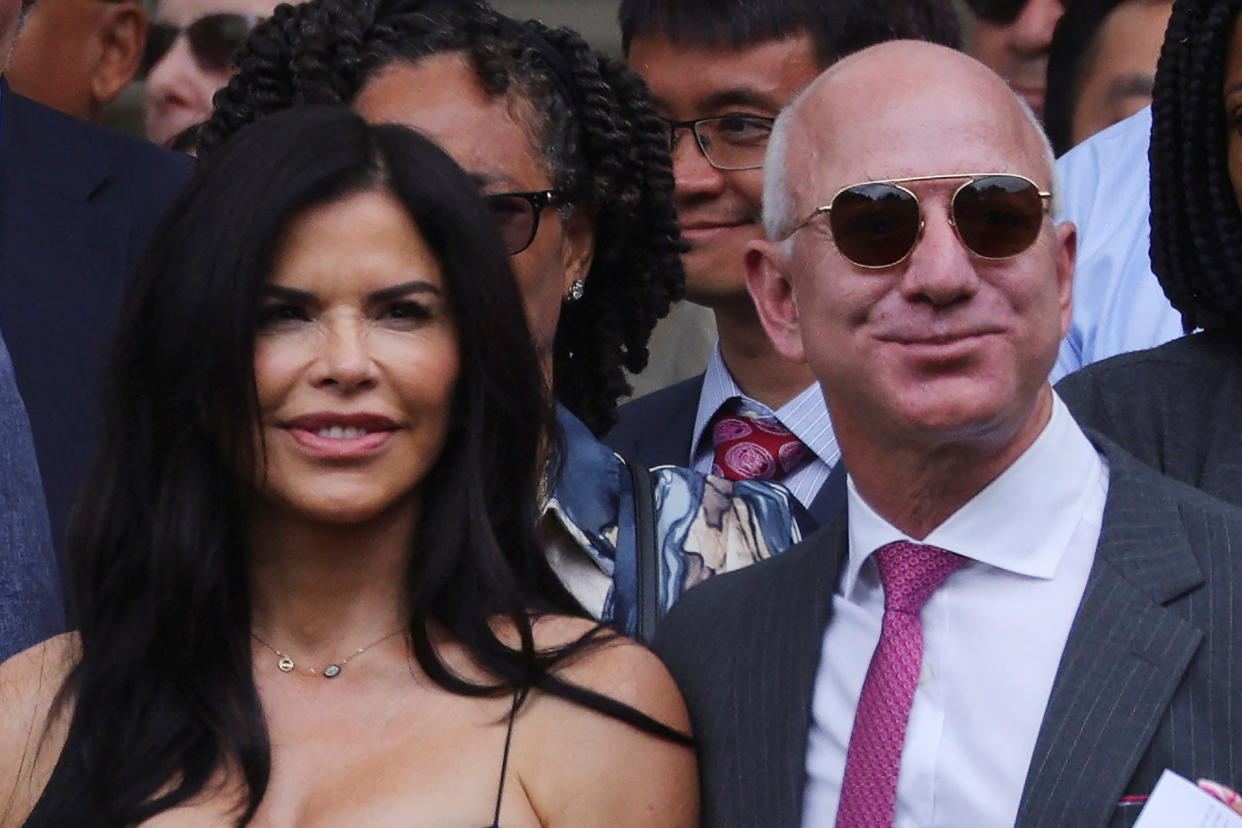 Amazon founder Jeff Bezos and Lauren Sanchez attend the Commencement ceremony at the Massachusetts Institute of Technology (MIT) in Cambridge, Massachusetts, U.S., May 27, 2022.   REUTERS/Brian Snyder