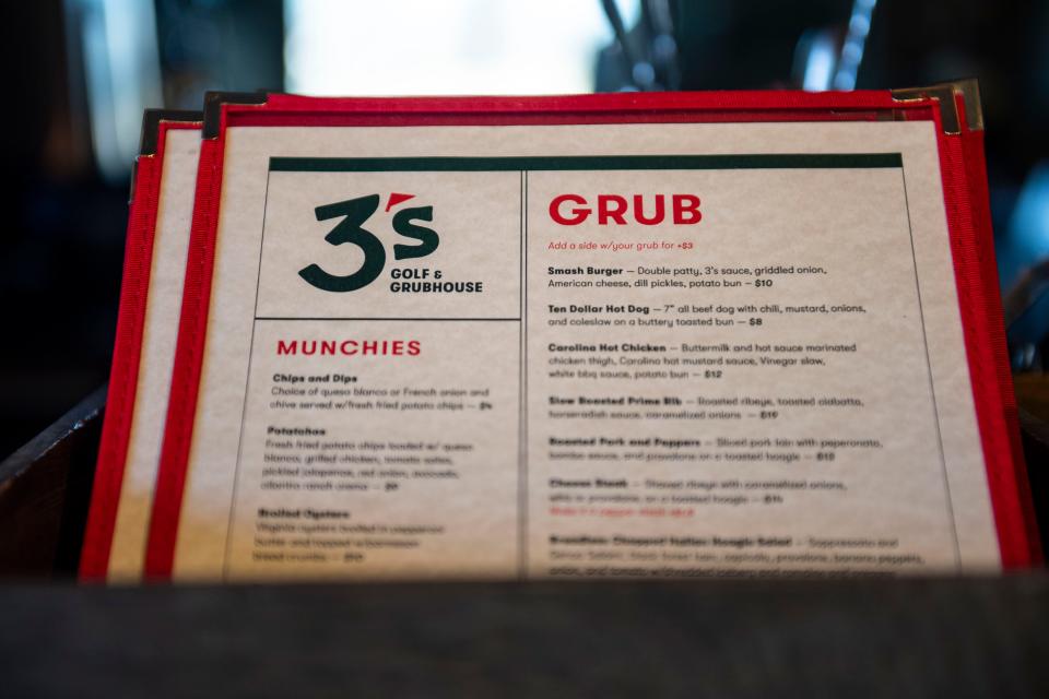 The Grubhouse menu at 3's Greenville Golf, is seen at the restaurant on Wednesday, Jan. 10, 2024.