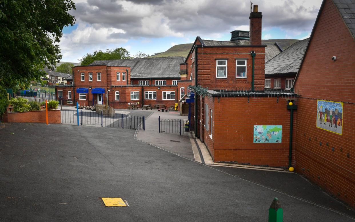 An empty playground at Milton St. John's Primary School which has been forced to close for a risk assessment by Public Health England after a confirmed case of COVID-19 was reported on May 22, 2020 in Mossley, United Kingdom - Councils could be told to 'justify their actions' if they refuse to reopen primary schools next week - GETTY IMAGES