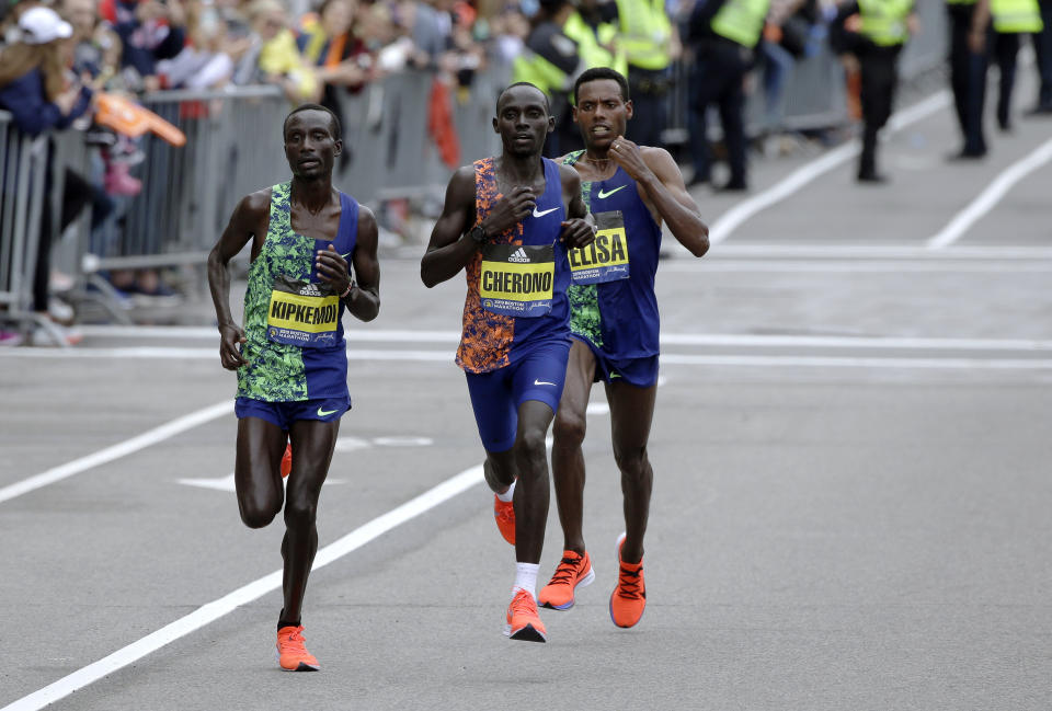 Kenneth Kipkemoi, left, and Lawrence Cherono, center, both of Kenya, and Lelisa Desisa, of Ethiopia, run the course during he 123rd Boston Marathon on Monday, April 15, 2019, in Boston. (AP Photo/Steven Senne)