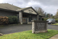 In this Dec. 9, 2019 photo, the City View Funeral Home is shown in Salem, Ore. The bodies of three Guatemalans who were killed in a crash involving a van carrying a group of workers home from work at a Christmas tree farm are being stored at the funeral home, pending their repatriation back to Guatemala. On Wednesday, Dec. 11, 2019, the U.S. House passed a bill that would loosen restrictions on hiring foreign agricultural workers and create a path to citizenship for more than 1 million farm workers estimated to be in the country illegally. The bill's fate in the Senate is unclear, and the White House hasn't said if President Donald Trump would sign it. But the 260-165 vote was a rare stroke of bipartisanship on immigration. (AP Photo/Andrew Selsky)