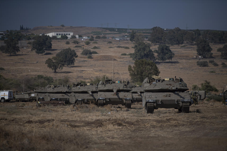 Israeli tanks are seen near the border with Lebanon on Tuesday, Oct. 10, 2023. (AP Photo/Gil Eliyahu)