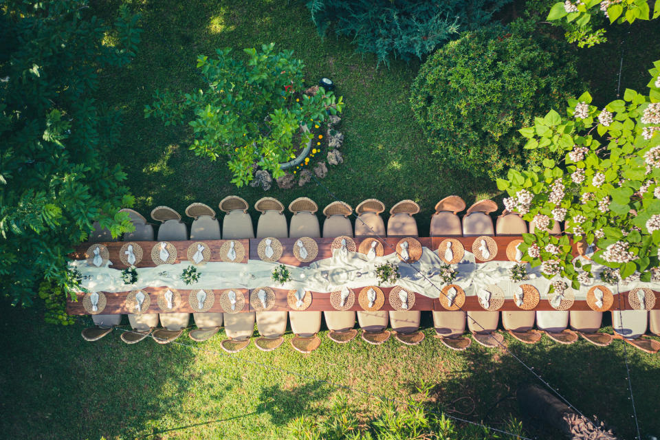 An aerial view of a very long feast table