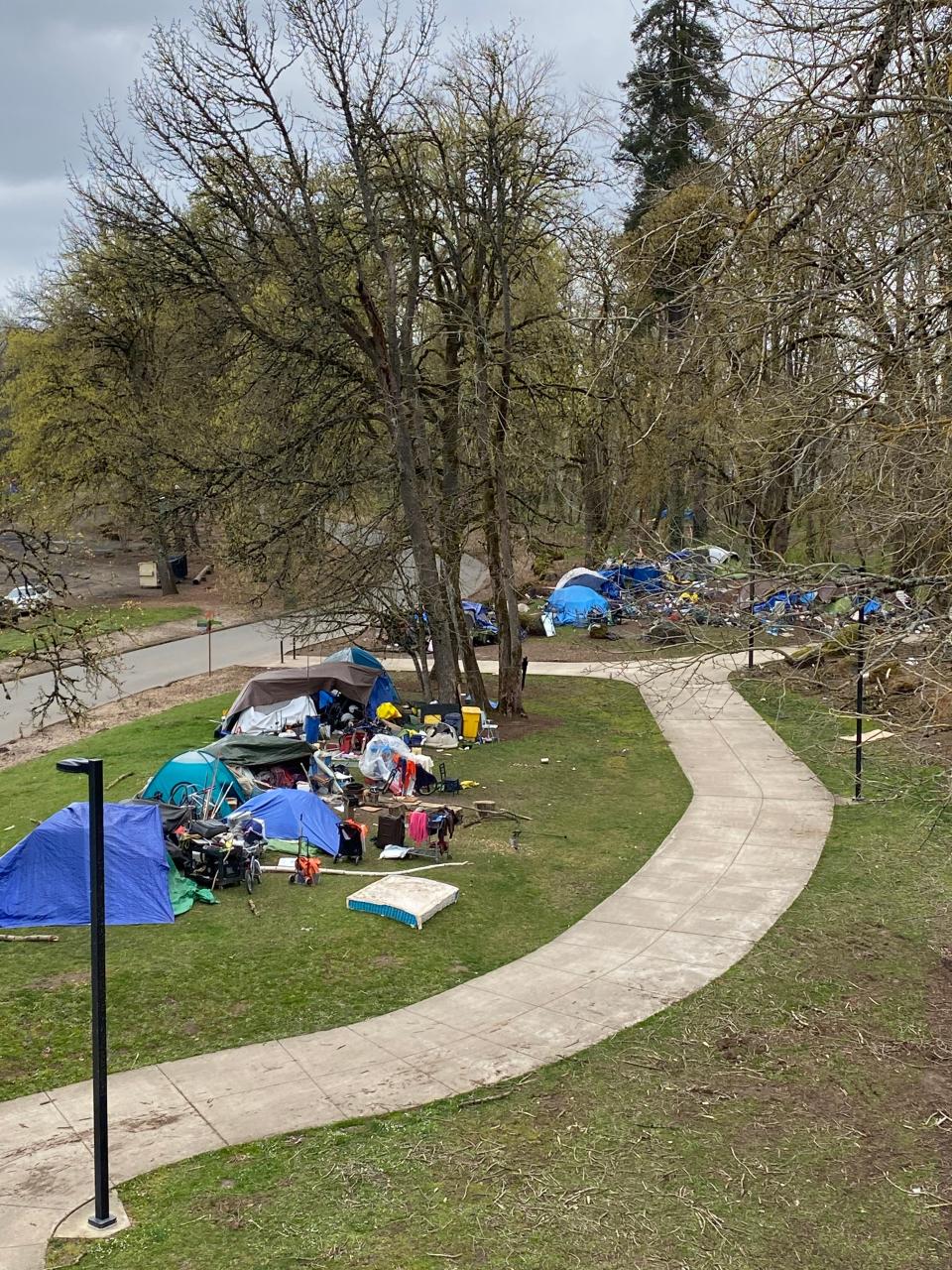 Homeless persons camp in 2021 at a park in Salem, Ore.