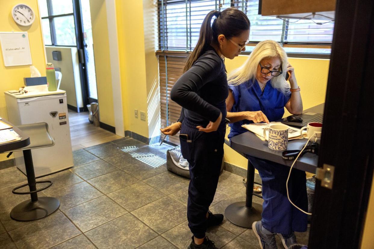 Dr. Barbara Zipkin, right, consults with a co-worker over ultrasound results at Camelback Family