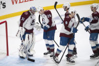 Colorado Avalanche players celebrate a 3-2 win over the Los Angeles Kings in an NHL hockey game Tuesday, Jan. 19, 2021, in Los Angeles. (AP Photo/Kyusung Gong)