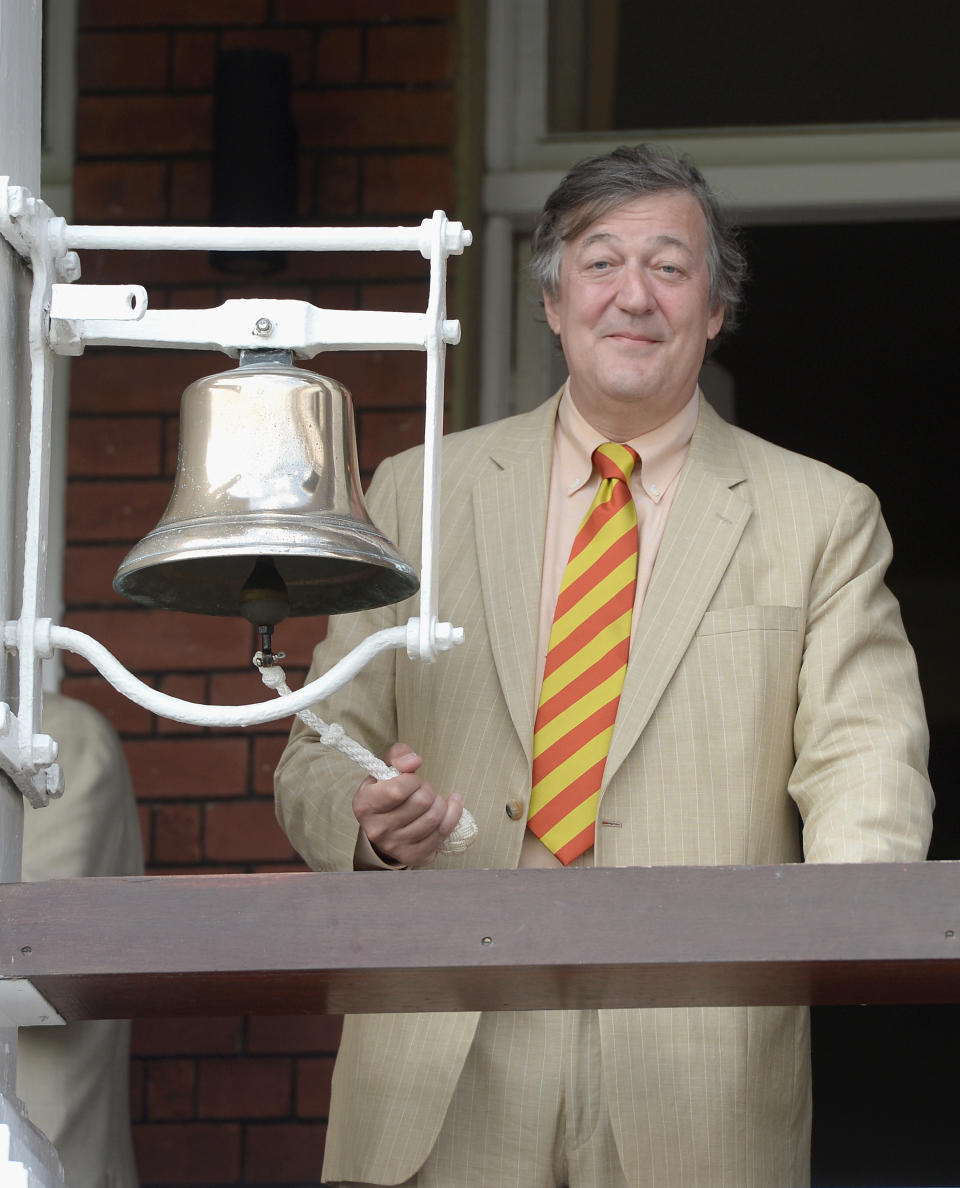 LONDON, ENGLAND - JULY 18:  British actor Stephen Fry rings the five minute bell ahead of day two of 2nd Investec Test match between England and India at Lord's Cricket Ground on July 18, 2014 in London, United Kingdom.  (Photo by Gareth Copley/Getty Images)