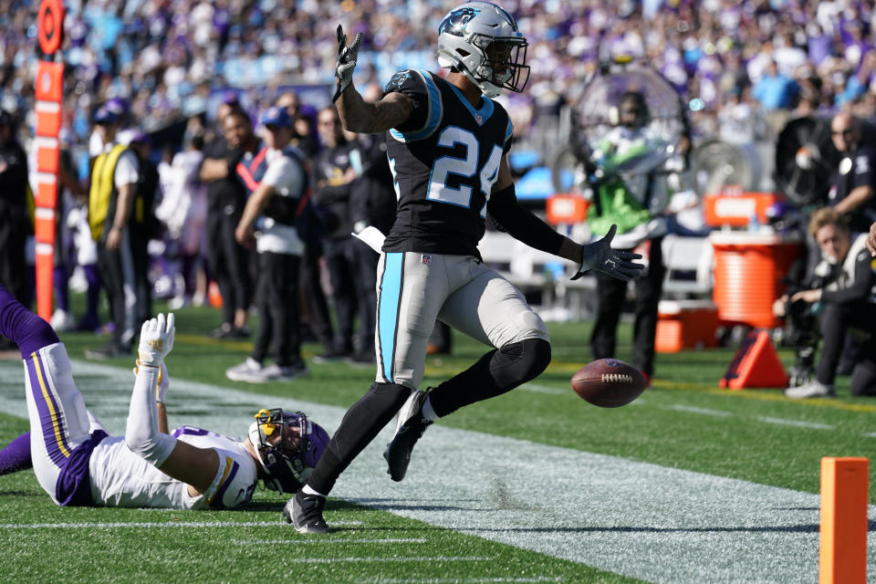 Carolina Panthers cornerback A.J. Bouye (24) breaks up a pass intended for Minnesota Vikings wide receiver Adam Thielen (19) during the second half of an NFL football game, Sunday, Oct. 17, 2021, in Charlotte, N.C. (AP Photo/Gerald Herbert)