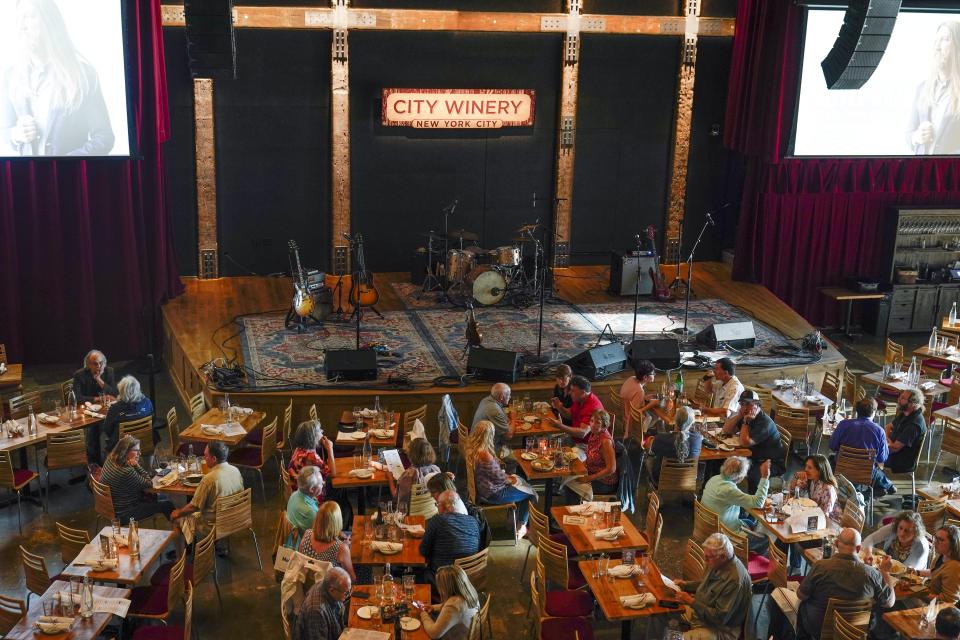 Patrons dine at City Winery Thursday, June 24, 2021, in New York. Customers wanting to wine, dine and unwind to live music at the City Winery's flagship restaurant in New York must show proof of a COVID-19 vaccination to get in. But that's not required at most other dining establishments in the city. And it's not necessary at other City Winery sites around the U.S. (AP Photo/Frank Franklin II)