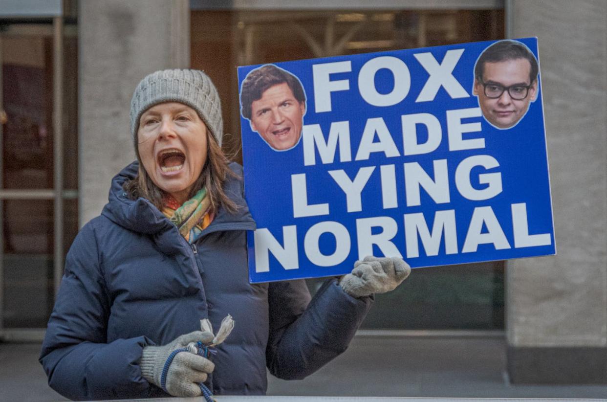There are no standards for what it takes to be a journalist. <a href="https://www.gettyimages.com/detail/news-photo/participant-seen-holding-a-sign-outside-fox-news-hq-members-news-photo/1247874350?adppopup=true" rel="nofollow noopener" target="_blank" data-ylk="slk:Erik McGregor/LightRocket via Getty Images;elm:context_link;itc:0;sec:content-canvas" class="link ">Erik McGregor/LightRocket via Getty Images</a>