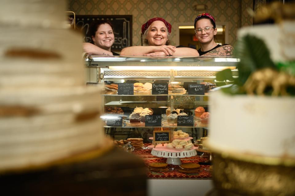 Owner Marci Mang, center, with Kendall Pittman, left, and Hannah Davis at Marci's Cakes and Bakes at 5474 Trade St. in Hope Mills.