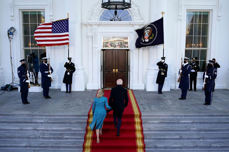 President Joe Biden and first lady Dr. Jill Biden walk up the stairs as they arrive at the North Portico of the White House.<span class="copyright">Shutterstock</span>