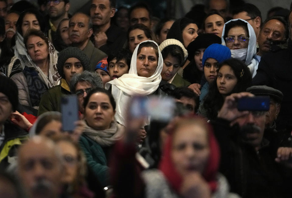 Iranian Zoroastrians watch a performance of dancers in a ceremony celebrating their ancient mid-winter Sadeh festival in the outskirts of Tehran, Iran, Tuesday, Jan. 30, 2024. Hundreds of Zoroastrian minorities gathered after sunset to mark their ancient feast, creation of fire, dating back to Iran's pre-Islamic past. (AP Photo/Vahid Salemi)