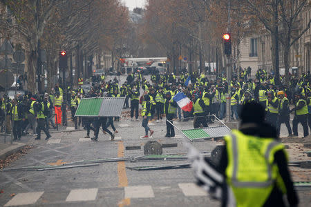 Protesters wearing yellow vests, a symbol of a French drivers' protest against higher diesel taxes, demonstrate in Paris, France, December 1, 2018. REUTERS/Stephane Mahe