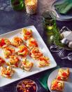<p><strong>Recipe: <a href="https://www.southernliving.com/recipes/shrimp-seasoned-crackers-pepper-jelly-cream-cheese" rel="nofollow noopener" target="_blank" data-ylk="slk:Shrimp on Seasoned Crackers with Pepper Jelly and Cream Cheese" class="link ">Shrimp on Seasoned Crackers with Pepper Jelly and Cream Cheese</a></strong></p> <p>These loaded cracker snacks are made party-worthy by simple, zesty shrimp. Beneath the seafood awaits the well-loved and easily smeared combination of pepper jelly and cream cheese.</p>