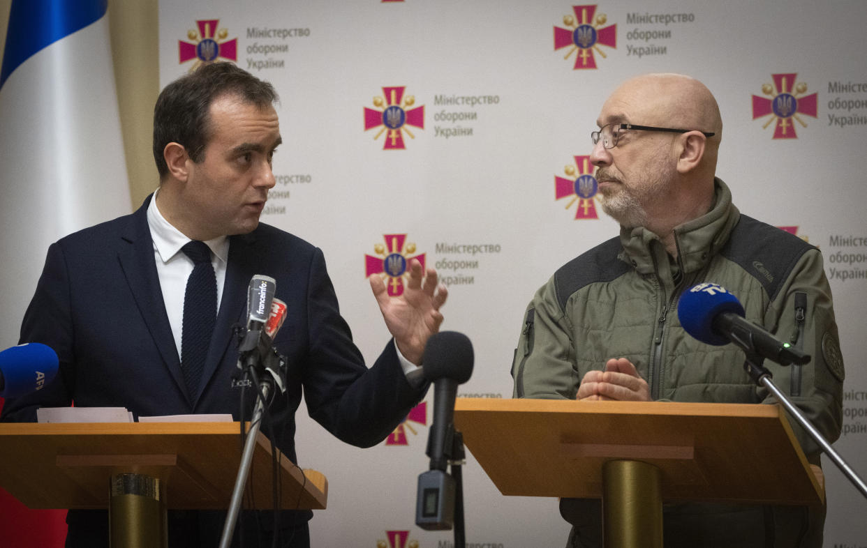 French Defense Minister Sebastien Lecornu, left, and his Ukrainian counterpart Oleksii Reznikov speak during a joint press conference in Kyiv, Ukraine, Wednesday, Dec. 28, 2022. (AP Photo/Efrem Lukatsky)
