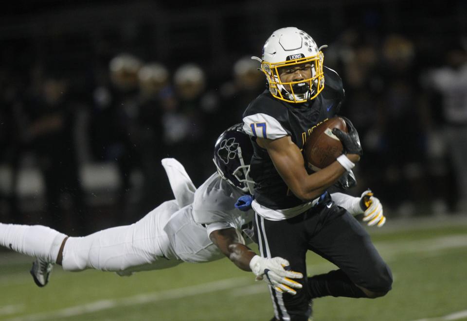 Gahanna Lincoln's Brayden Sanders is tackled by Pickerington Central's Isaiah Crozier during the Lions' 38-14 win in a Division I, Region 3 semifinal Nov. 11 at DeSales. The top-seeded Lions will play third-seeded New Albany in the Region 3 final Nov. 18.