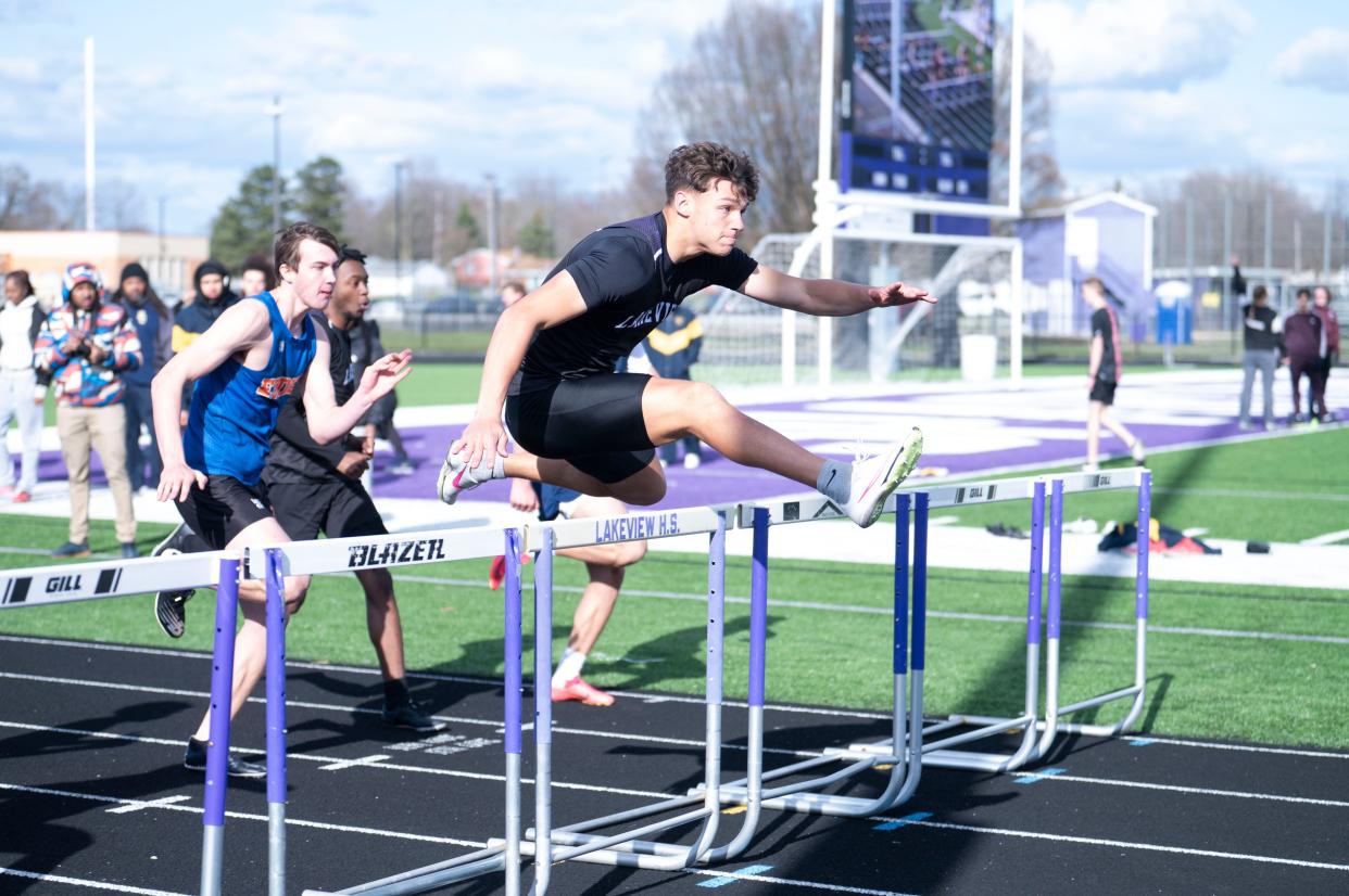 Lakeview senior Davis Barr jumps in the 110 meter hurdle race during the Lakeview Track and Field Invitational at Lakeview High School on Friday, April 5, 2024.