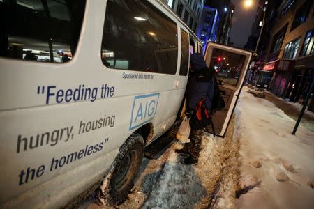 A homeless man is seen after he received a hot meal and donated clothing as New York City's Coalition for the Homeless delivers food, donated clothing and supplies to homeless people as part of their weekly distribution during winter storm Grayson in Manhattan, New York City, U.S., January 4, 2018. REUTERS/Amr Alfiky