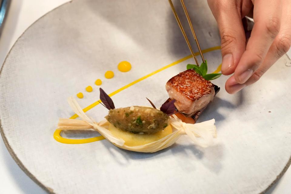 Chef David Brito, a rising star in Phoenix fine-dining, plates a 14-Day Dry Aged Squab-Foie gras, beetroot, creme brulee sweet potato tamale, mandarin, confit leg and jus in Scottsdale in 2023.