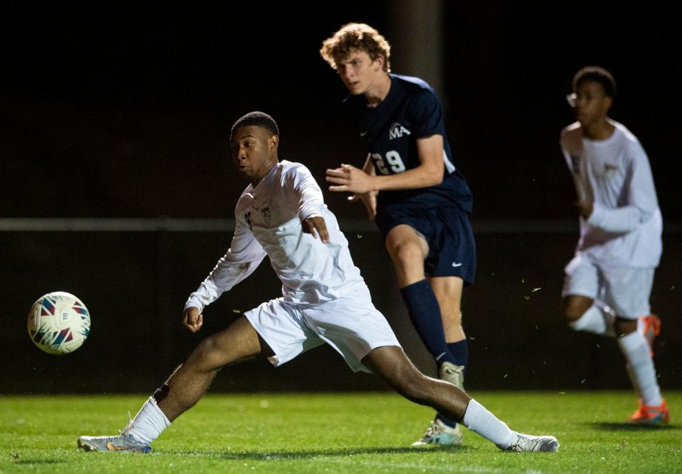 Montgomery Academy's John Allen Lachney (29) shoots around Park Crossing’s Tyler Pettway (15) as Montgomery Academy takes on Park Crossing at Montgomery Academy in Montgomery, Ala., on Thursday, April 13, 2023.