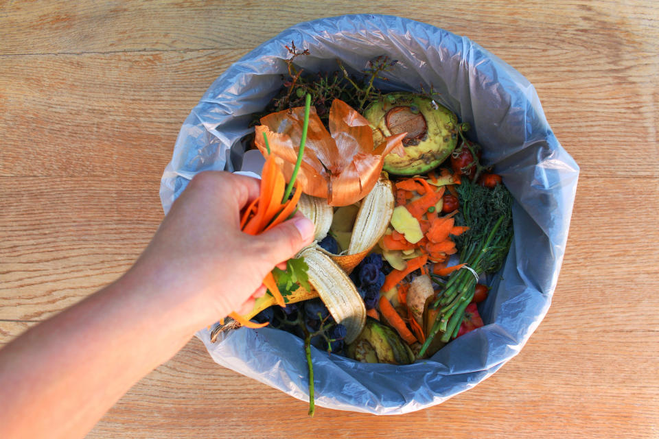 Fruit and veg seen in a bin.