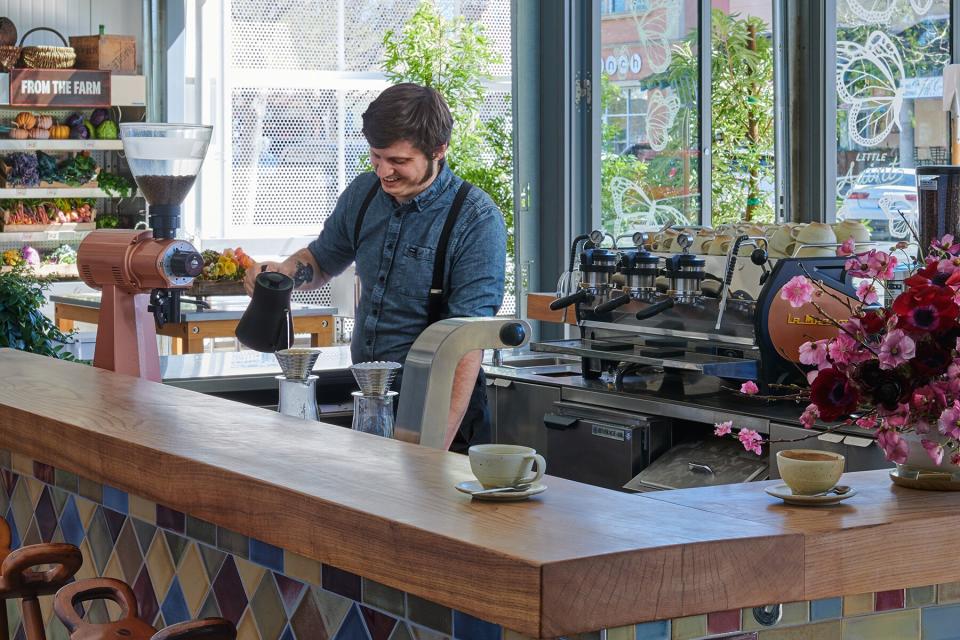 James behind at the cafe at Little Saint