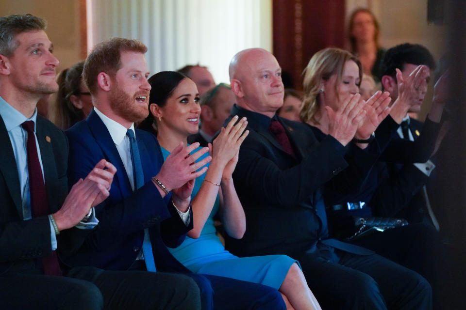 The Duke and Duchess of Sussex cheer during a marriage proposal at the Endeavour Fund Awards at Mansion House in London.