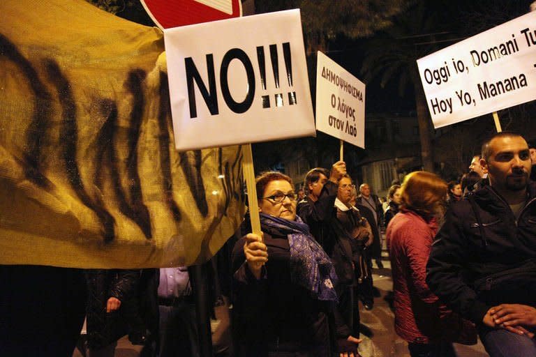 A demonstration against an EU bailout deal outside the parliament in Nicosia, March 19, 2013. Cypriot President Nicos Anastasiades has called an emergency meeting of party leaders Wednesday in a frantic search for a viable plan B after MPs rejected the terms of an EU bailout aimed at saving Cyprus from bankruptcy