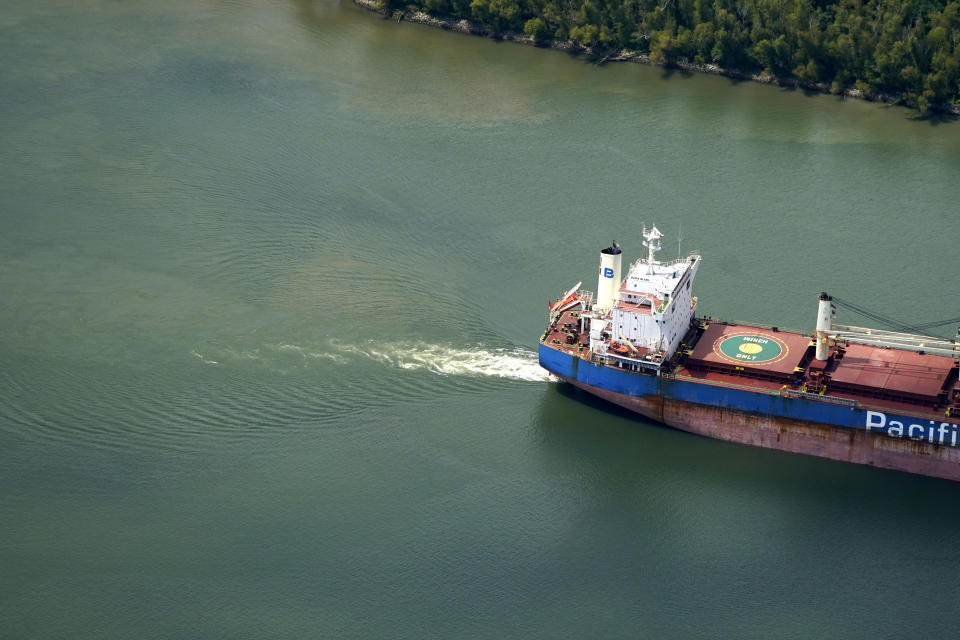 FILE - In this aerial photo, sediment and mixed river water is seen as a tanker ship moves upriver, Sept. 26, 2023, in Plaquemines Parish, La. Salt water from the Gulf of Mexico has caused problems for water systems in Plaquemines Parish. Fears that it would reach New Orleans’ water intakes have abated amid improved forecasts, but officials in the area say the threat could return in years to come as climate change, sea level rise and dredging of the river for commercial traffic all could contribute to salt water intrusion. (AP Photo/Gerald Herbert, File)